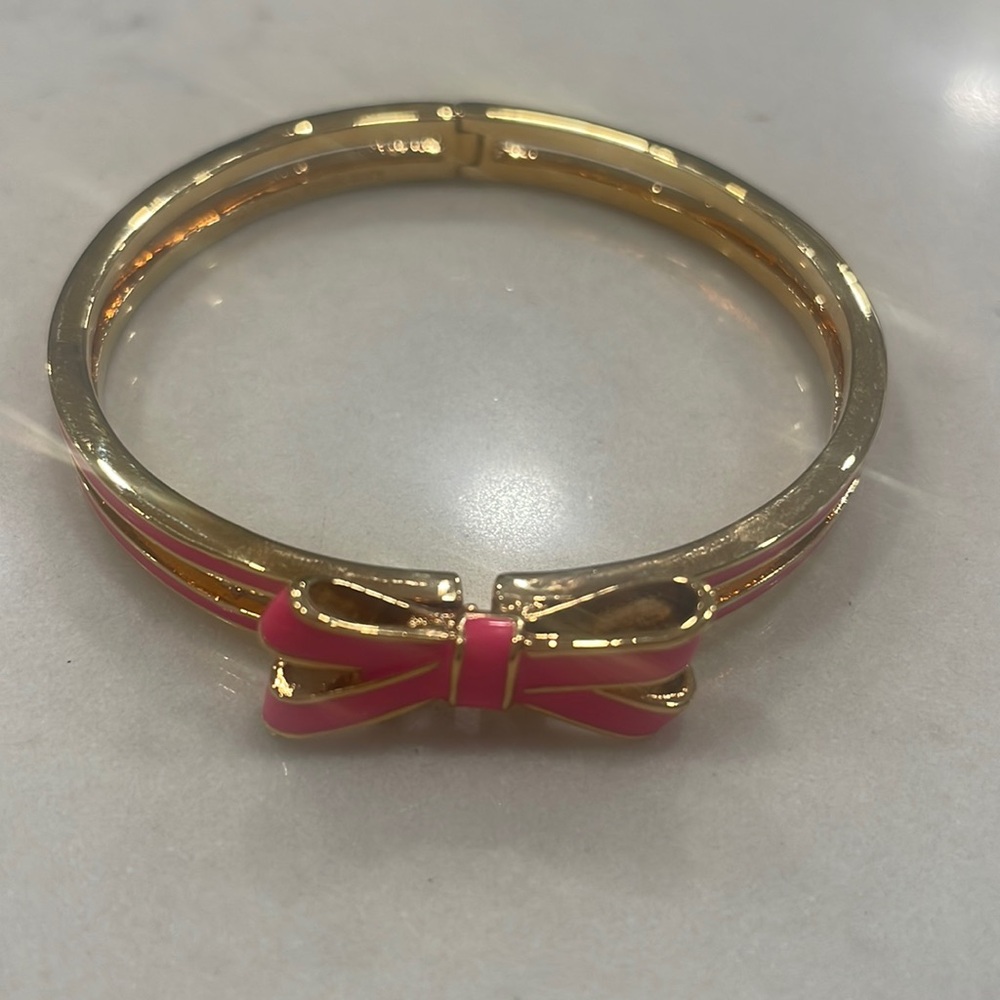 Beautiful pink and gold Kate Spade bow bangle bracelet